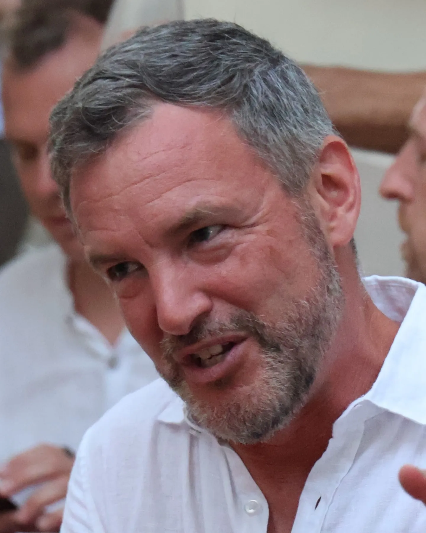 Andrew Venture, founder of Scale to Zen, mid-conversation at a table